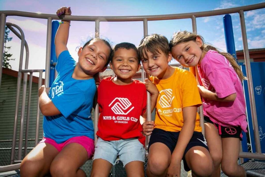 children in boys and girls club tee shirts